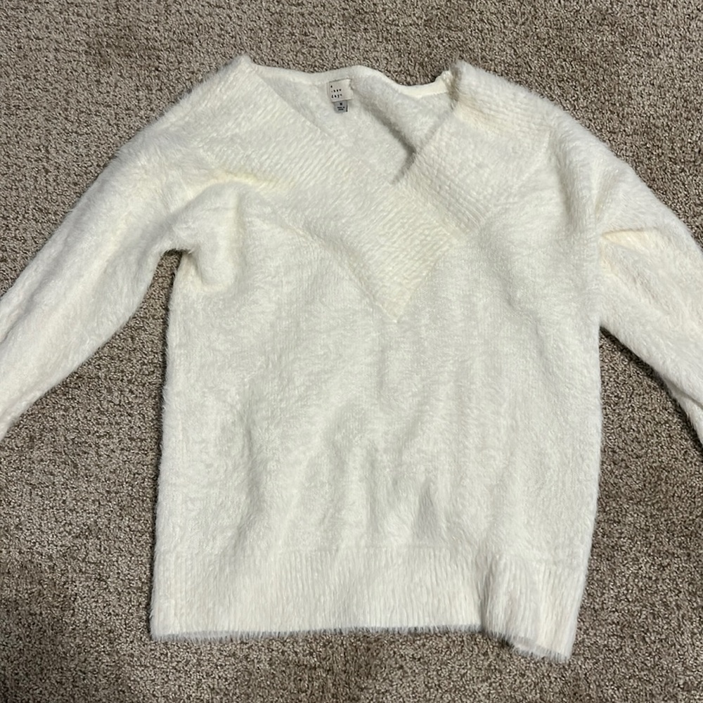 White fuzzy sweater with v neck
